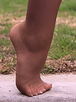 Feet in tan pantyhose young lady in high heels