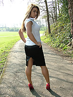 Slender minx in high heels and nylons